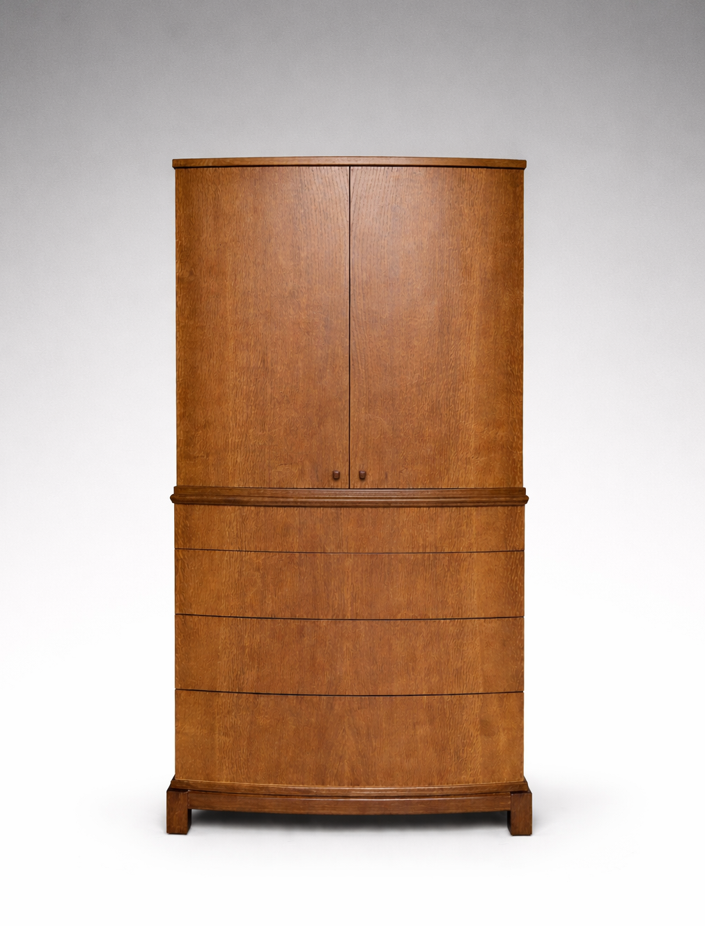 A wooden cabinet with four drawers at the bottom and two doors at the top, standing against a plain white background.