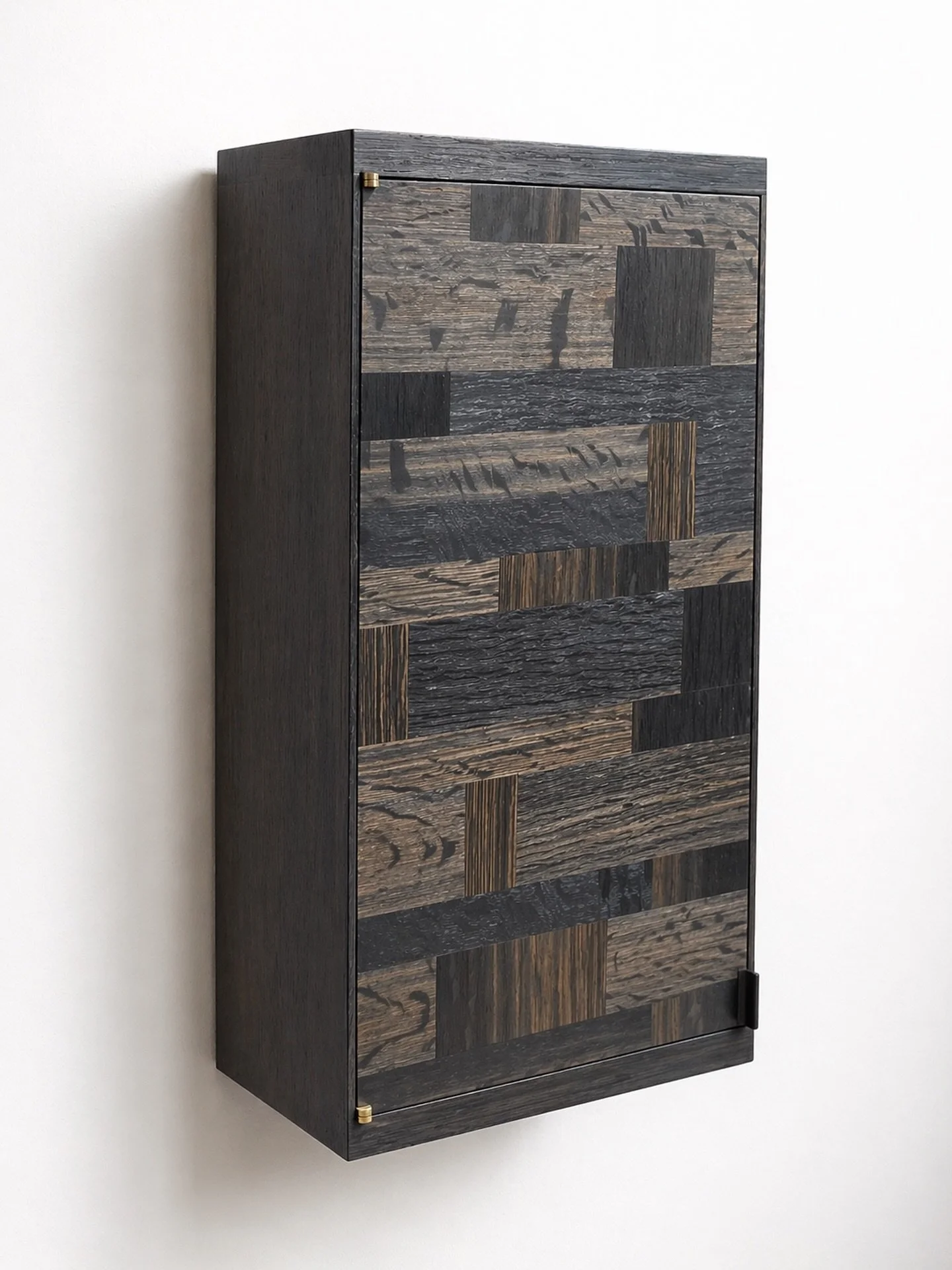 The second parquetry bog oak cabinet I&rsquo;ve made, and the fifth wall cabinet in 5,000-year-old Irish bog oak.
An extraordinary material to work with &mdash; every board carries its own shifts of colour, texture, medullary rays and figure.

With b