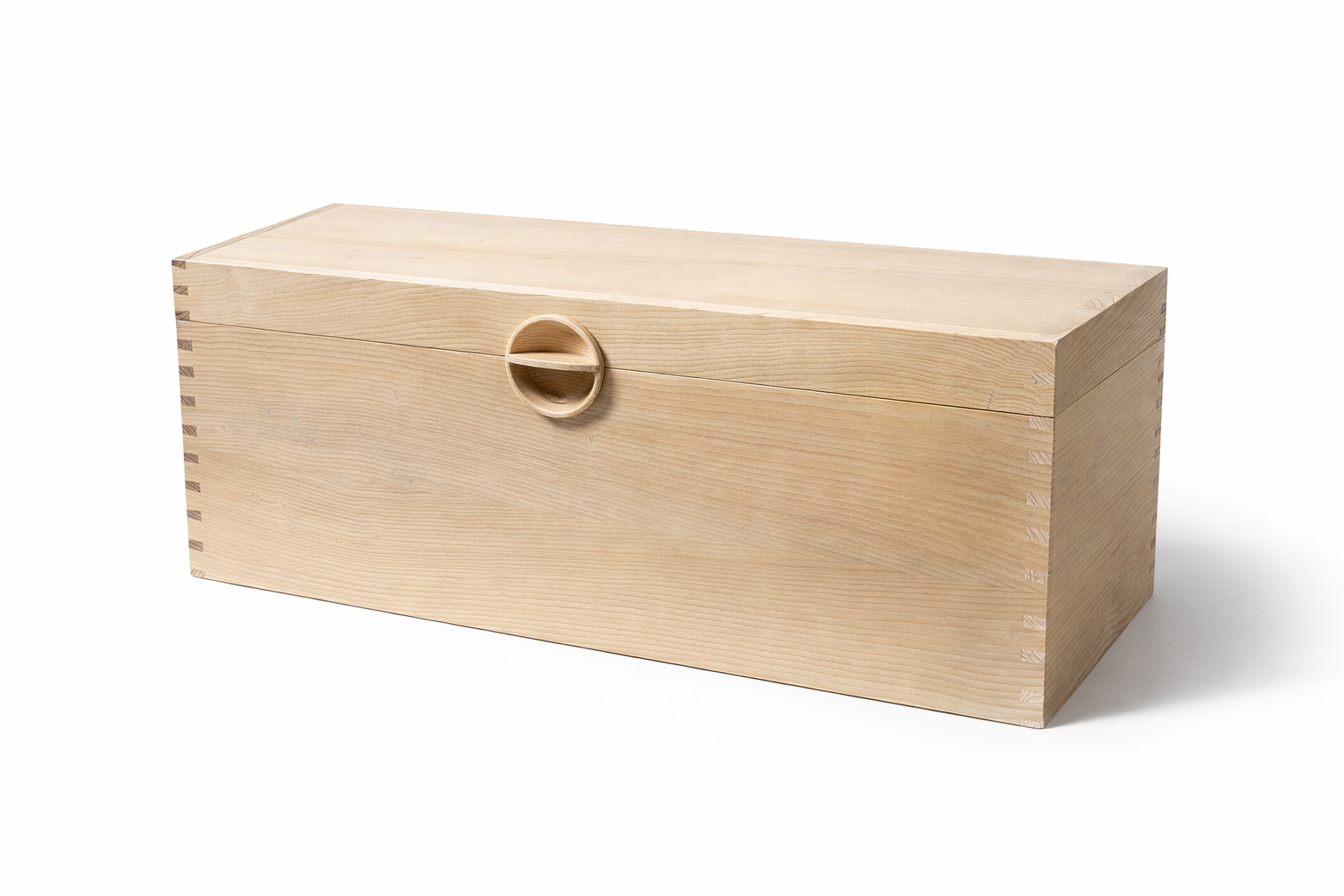 Unfinished wooden box with a round recessed handle on the front.