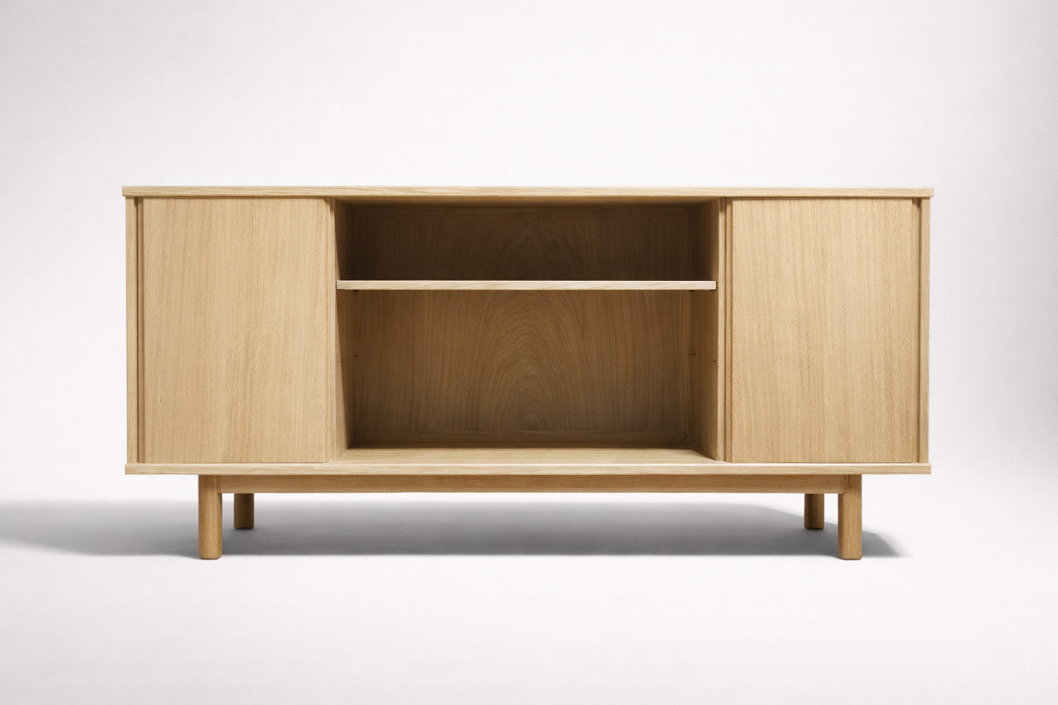 Unfinished wooden sideboard with three storage compartments, two with sliding doors and one open shelf, on a white background.