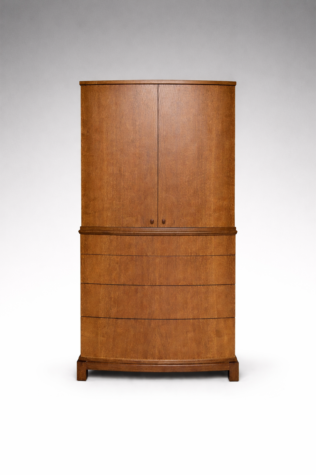 A wooden cabinet with four drawers and two doors, made of polished wood, standing on small legs against a plain white background.