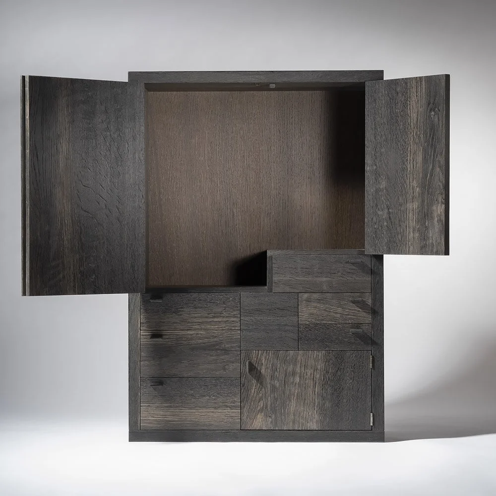 Dark wood cabinet with doors open revealing interior storage space