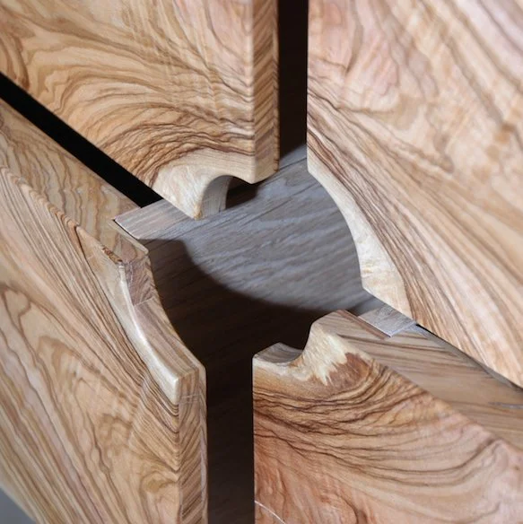 Close-up of interlocking wooden pieces with a smooth, patterned surface.