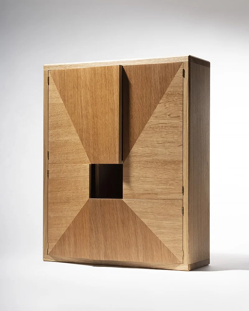 A wooden cabinet with a geometric design, featuring four large, four triangle hardwood panels with a small square opening in the center.
