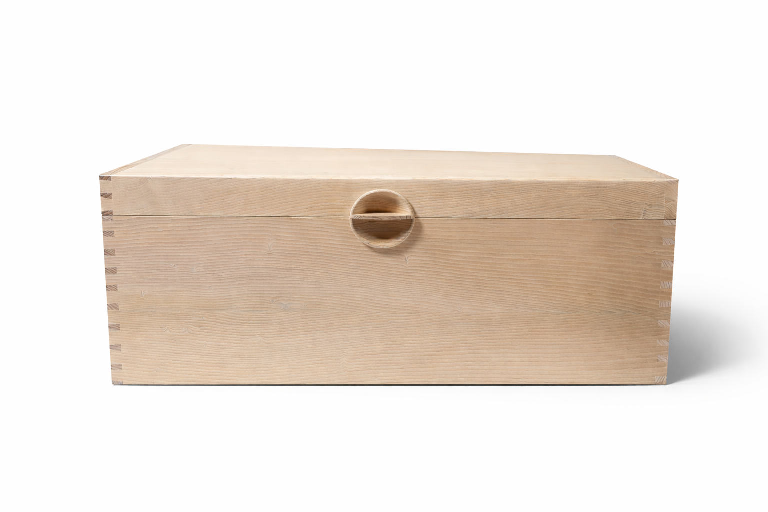 A light-colored wooden box with dovetail joints and a round wooden knob on the front.