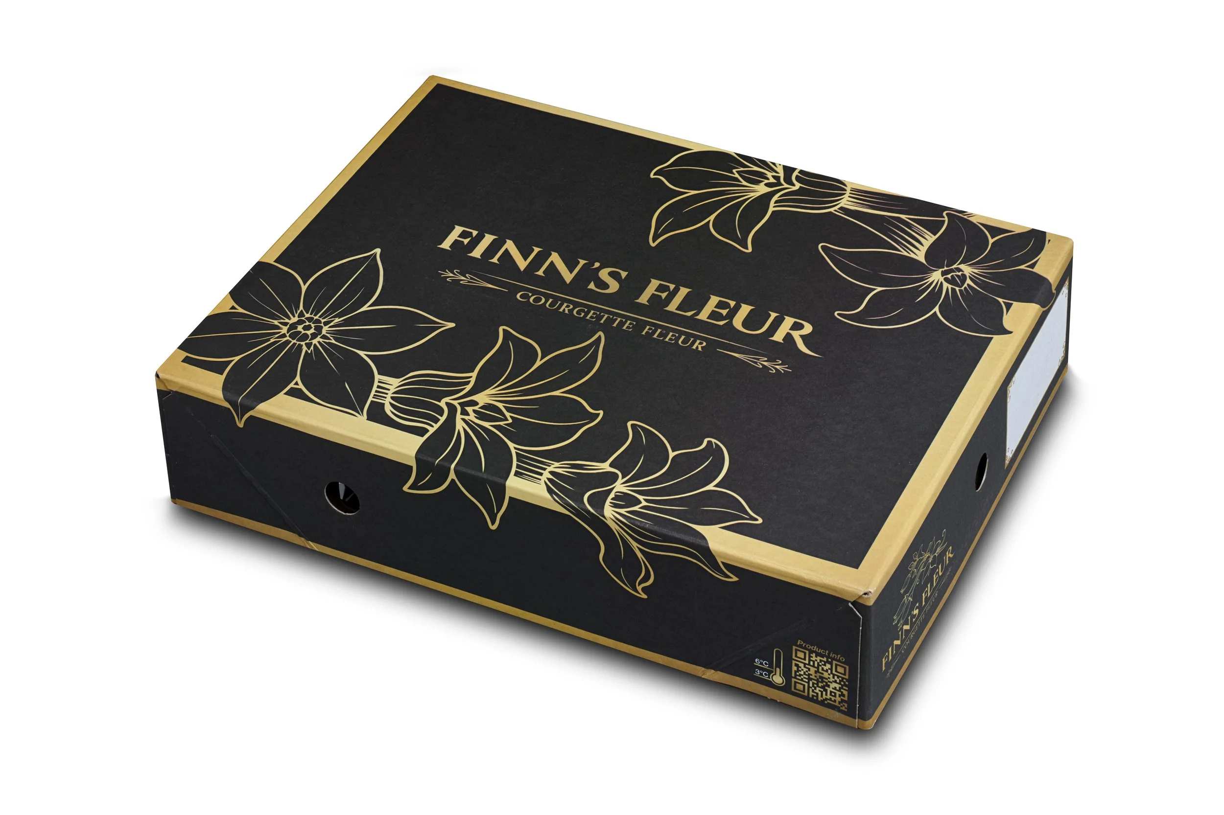 Black and gold gift box of Finn's Fleur courgette fleurs with floral packaging design.