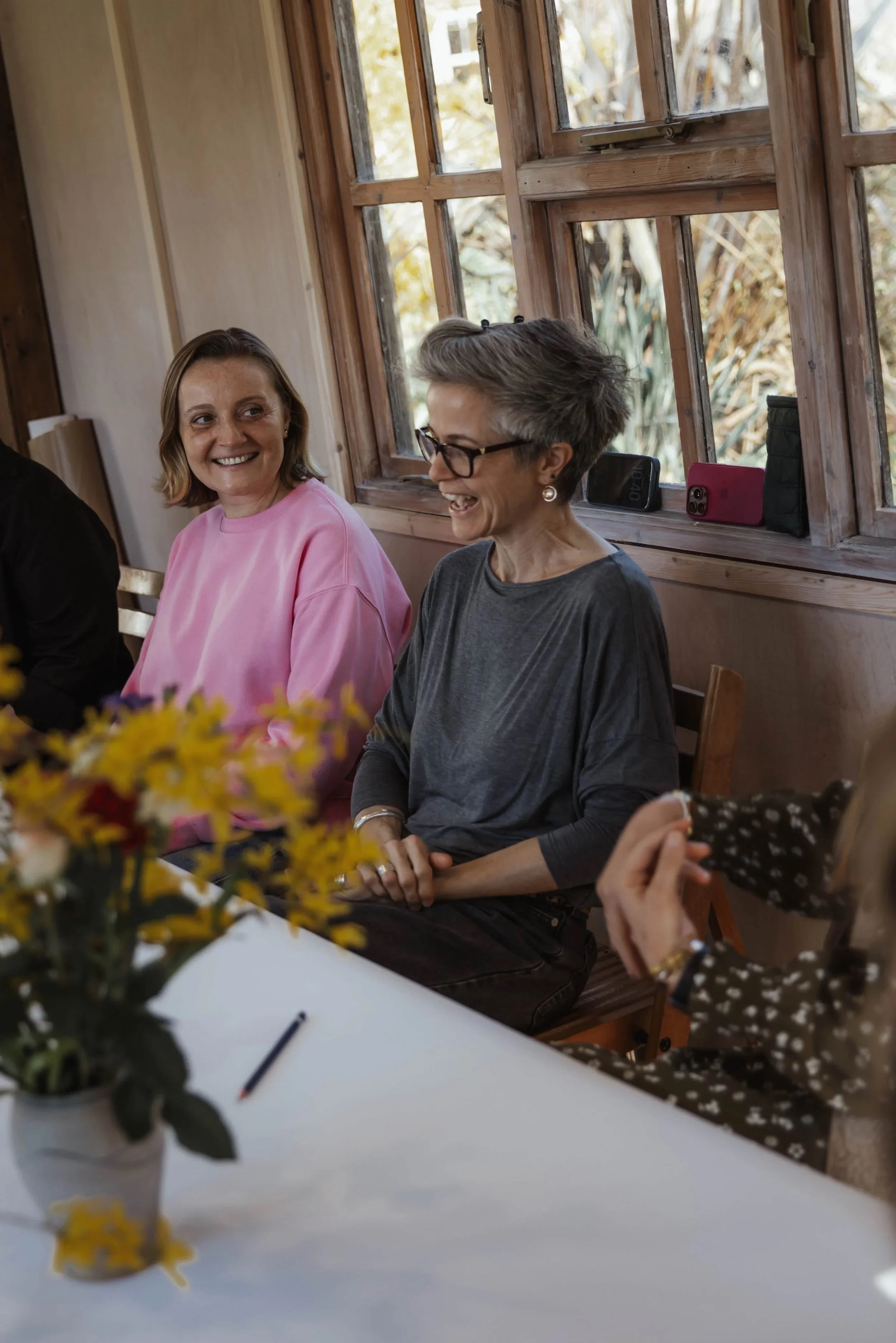 An example of a creative pause workshop, women smiling and laughing