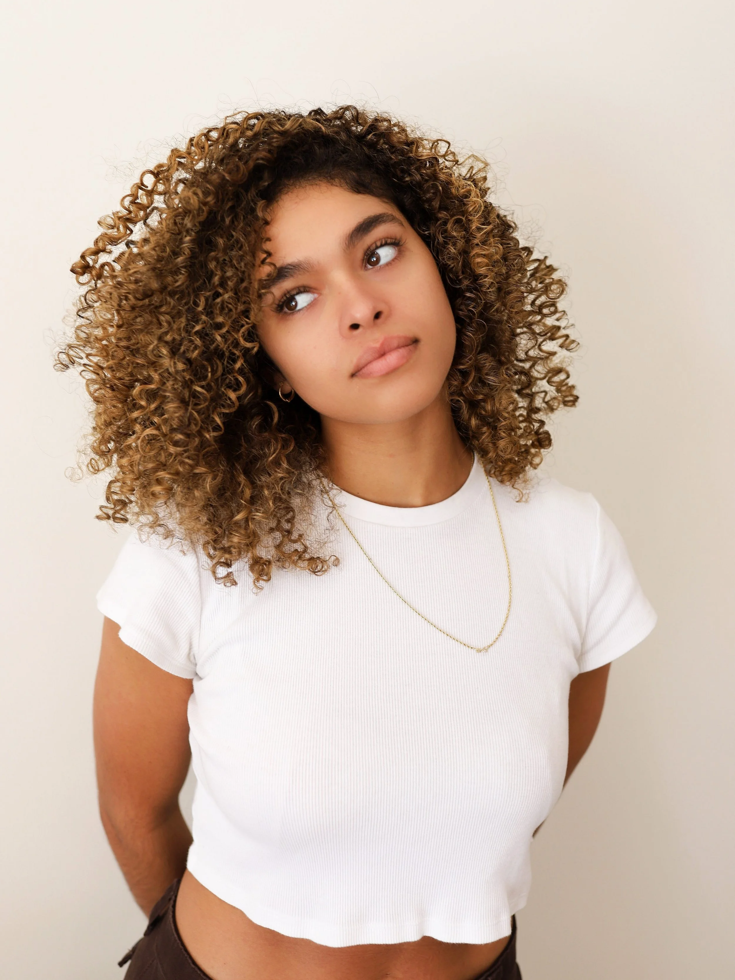 dimensional dark blonde/light brown curly hair color