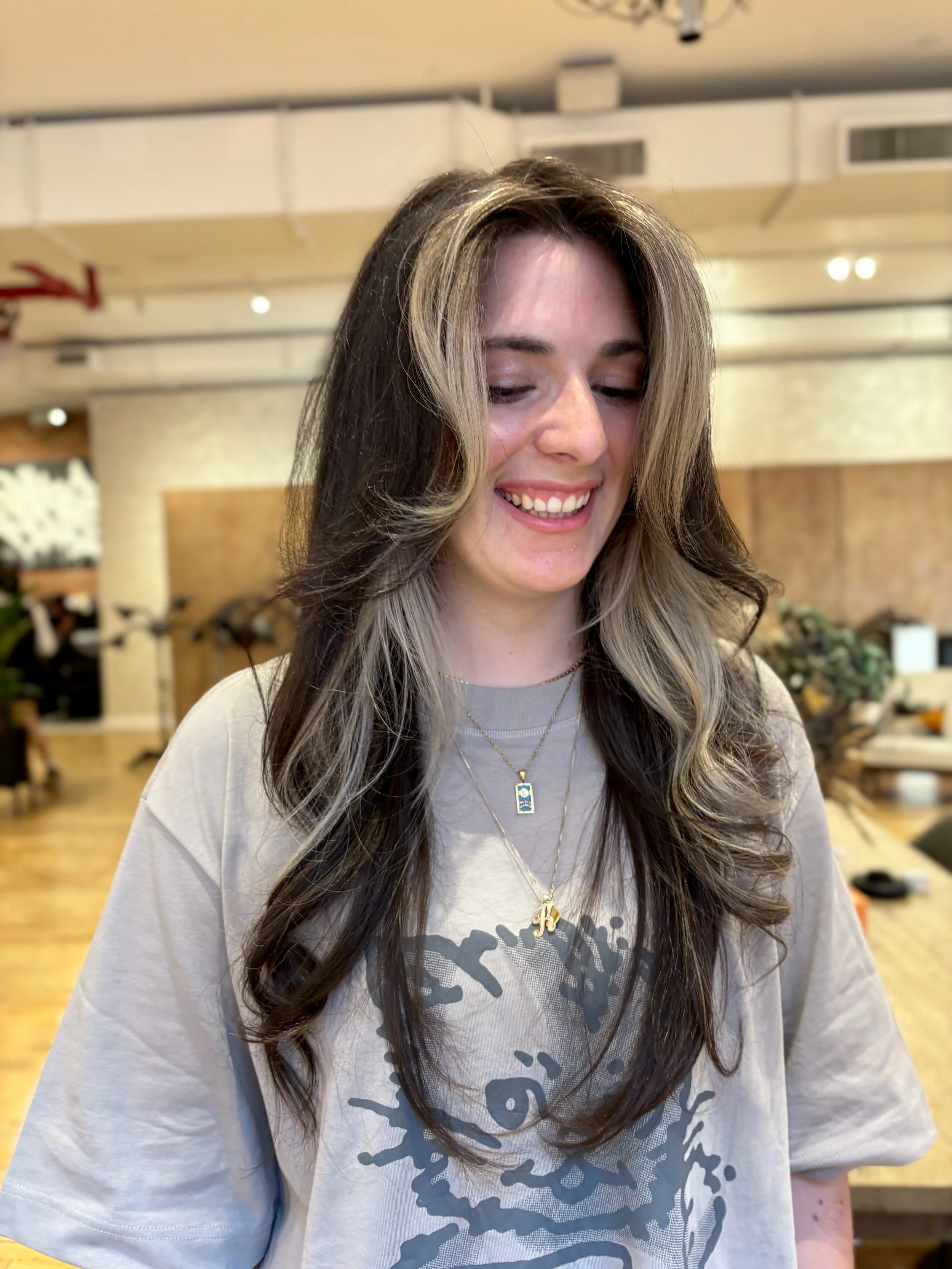 long dark brown hair with white blonde face framing highlights