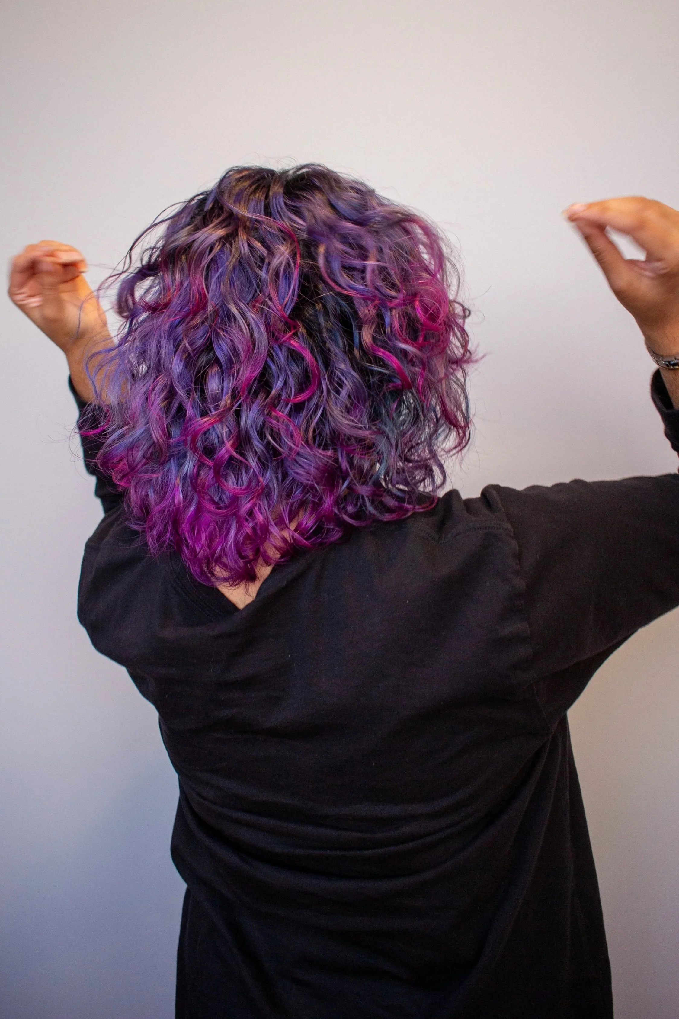 curly hair with varitations of blue, pink, and purple color