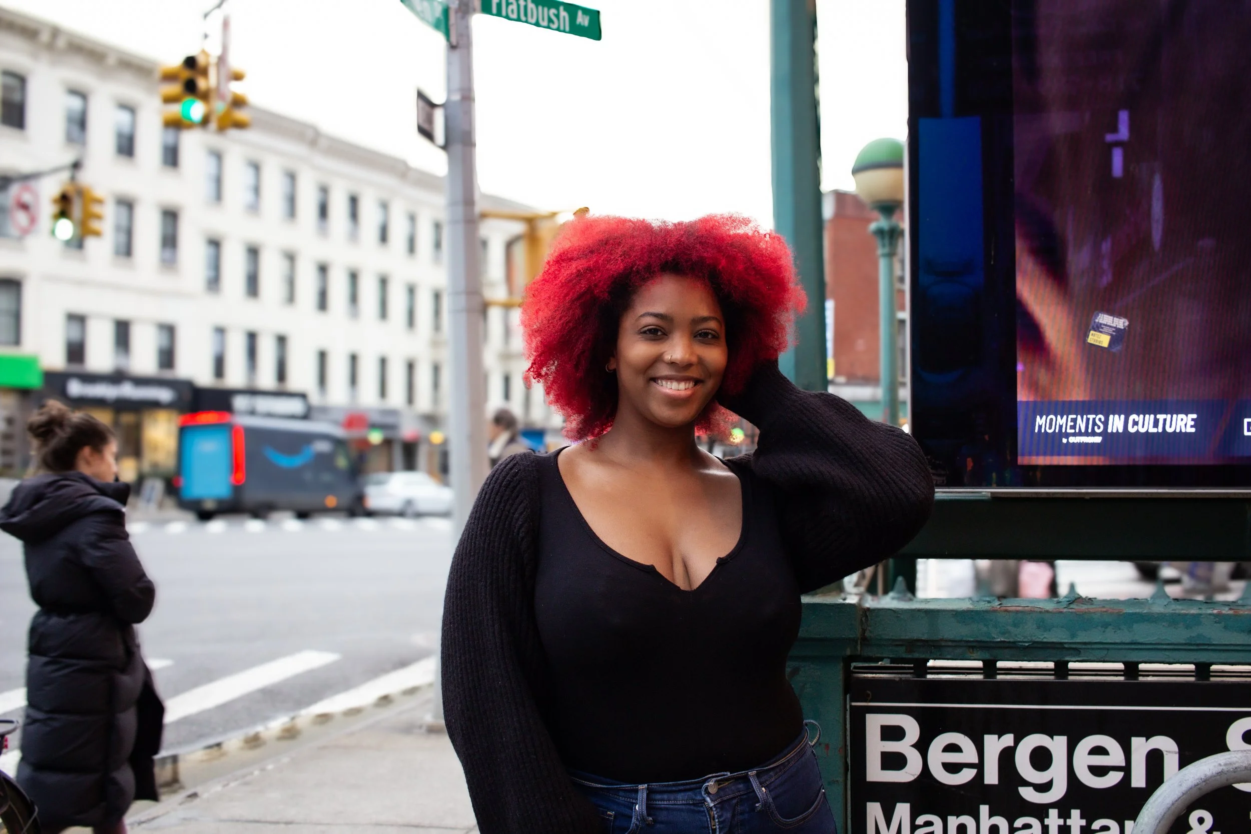 tightly coiled cherry red hair in afro