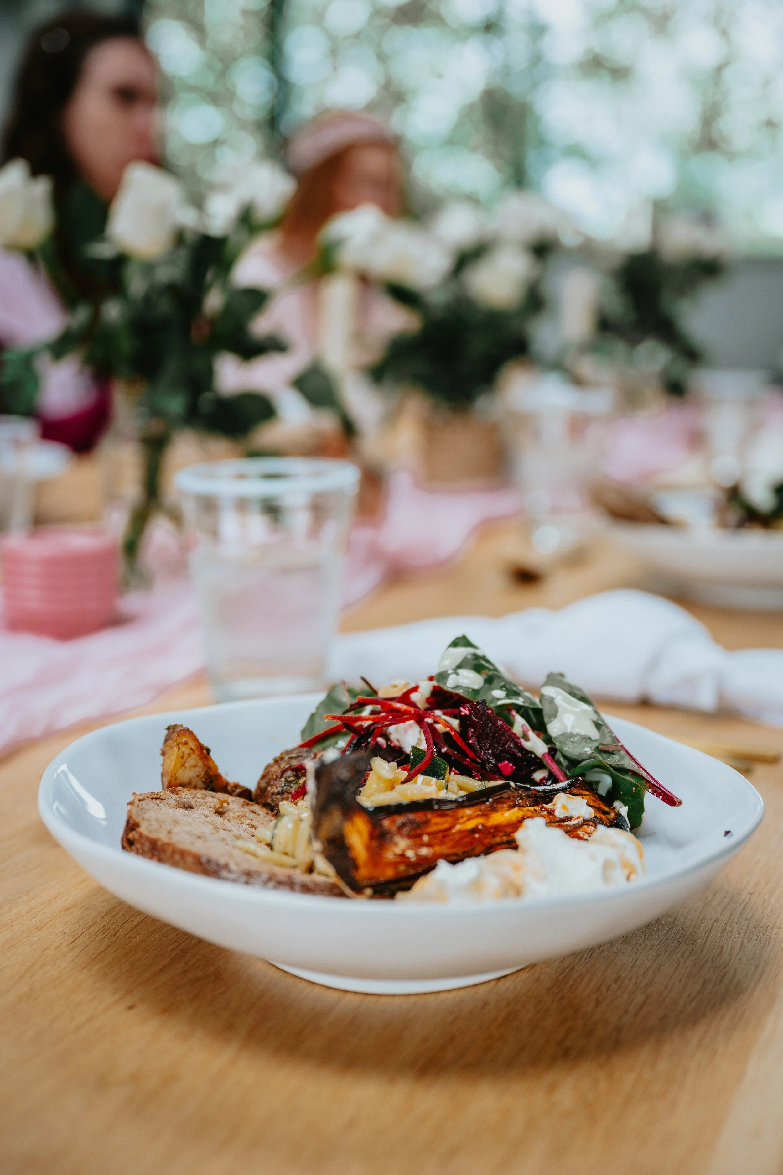 wedding table setting with bowl of food, feasting style, relaxed buffet