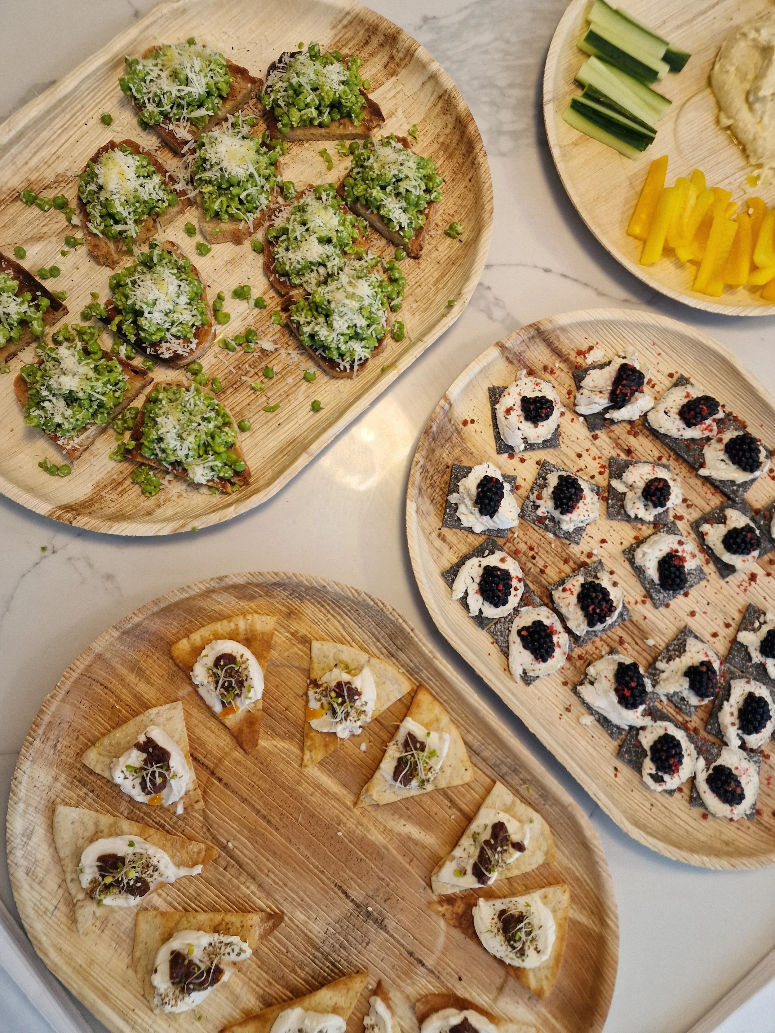 canapés and light bites on palm leaf sustainable platters for catering