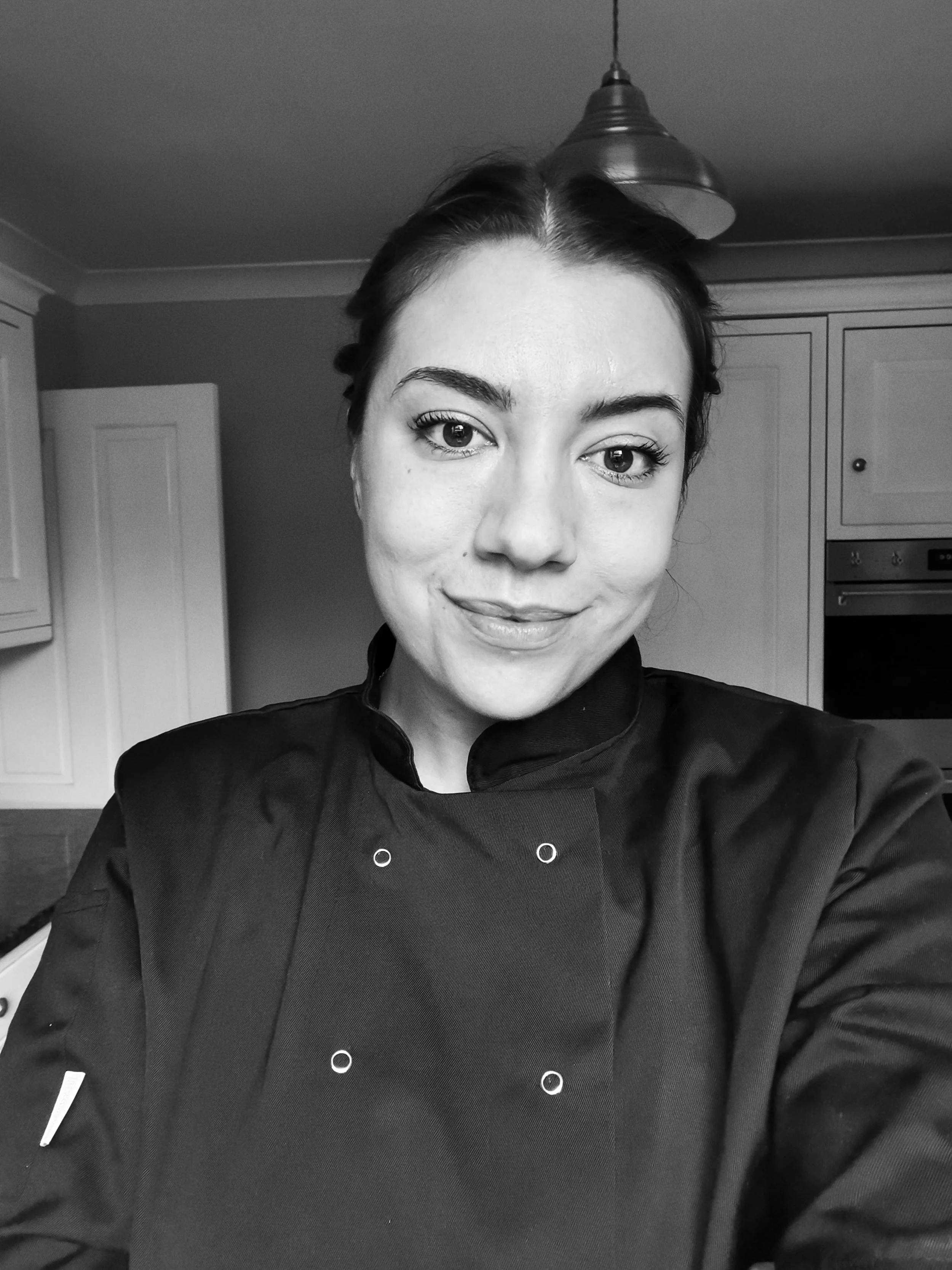 image of amie, founder and owner in chef blacks, professional essex catering