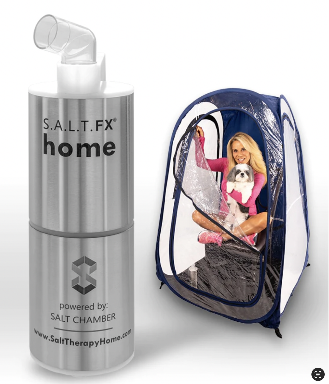 A woman sitting inside a portable pet enclosure with a dog, next to a large silver salt therapy device labeled S.A.L.T. FX home, powered by SALT CHAMBER.