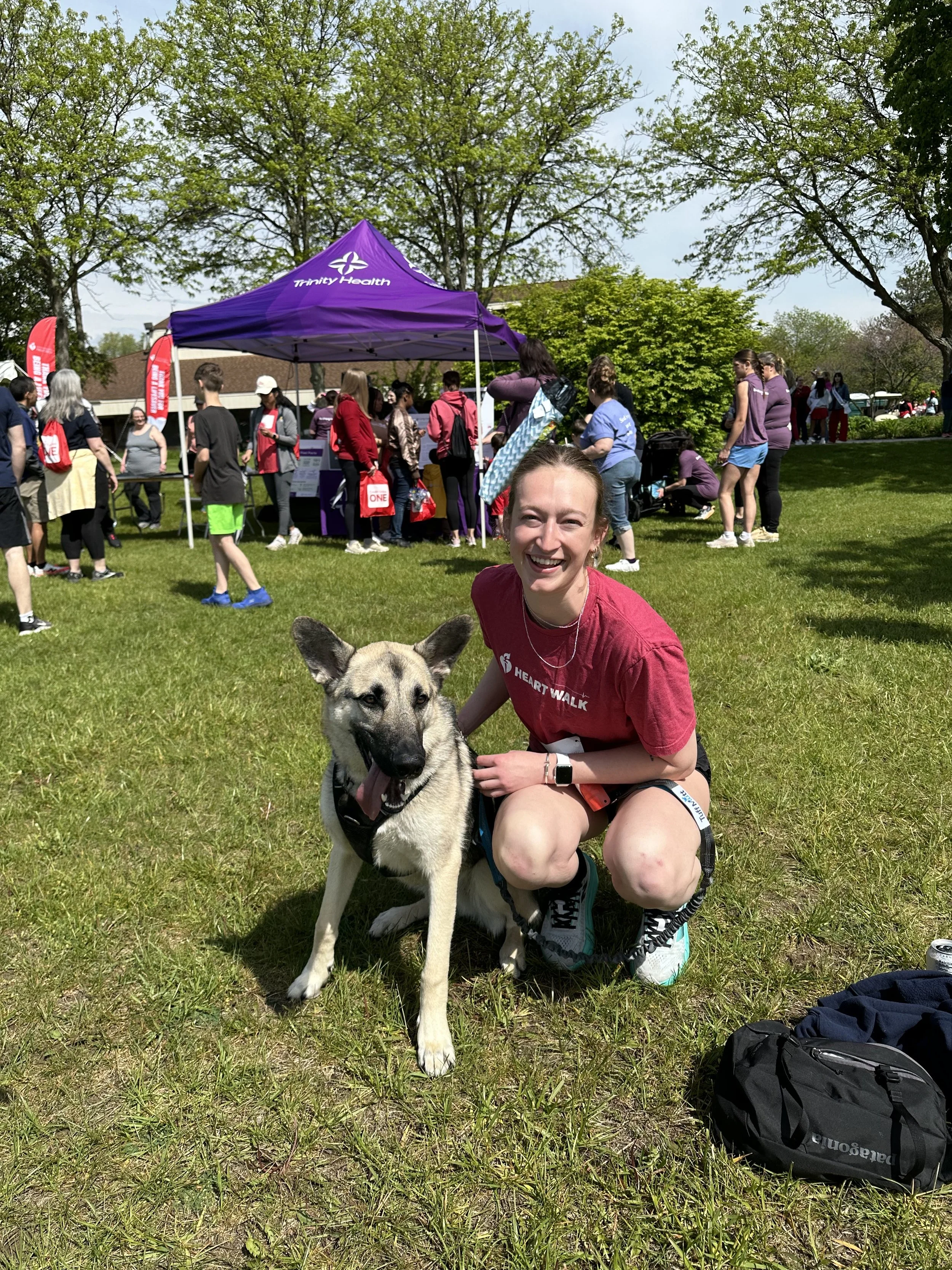  INSIGHT-CPR team member Kyleigh Moll poses with her dog at the Heart and Stroke Walk. 