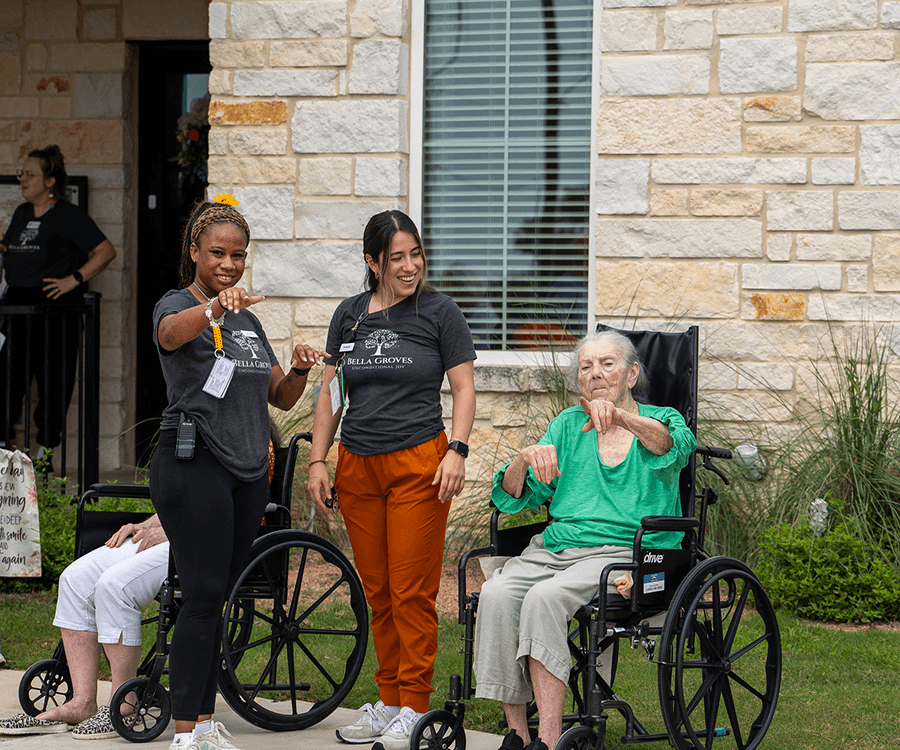 Bella Groves caregivers providing compassionate, personalized memory care while spending quality time with a resident at our residential dementia care community serving Bulverde and the San Antonio area.