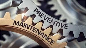 Close-up of two interlocking gears labeled 'Preventive' and 'Maintenance'.