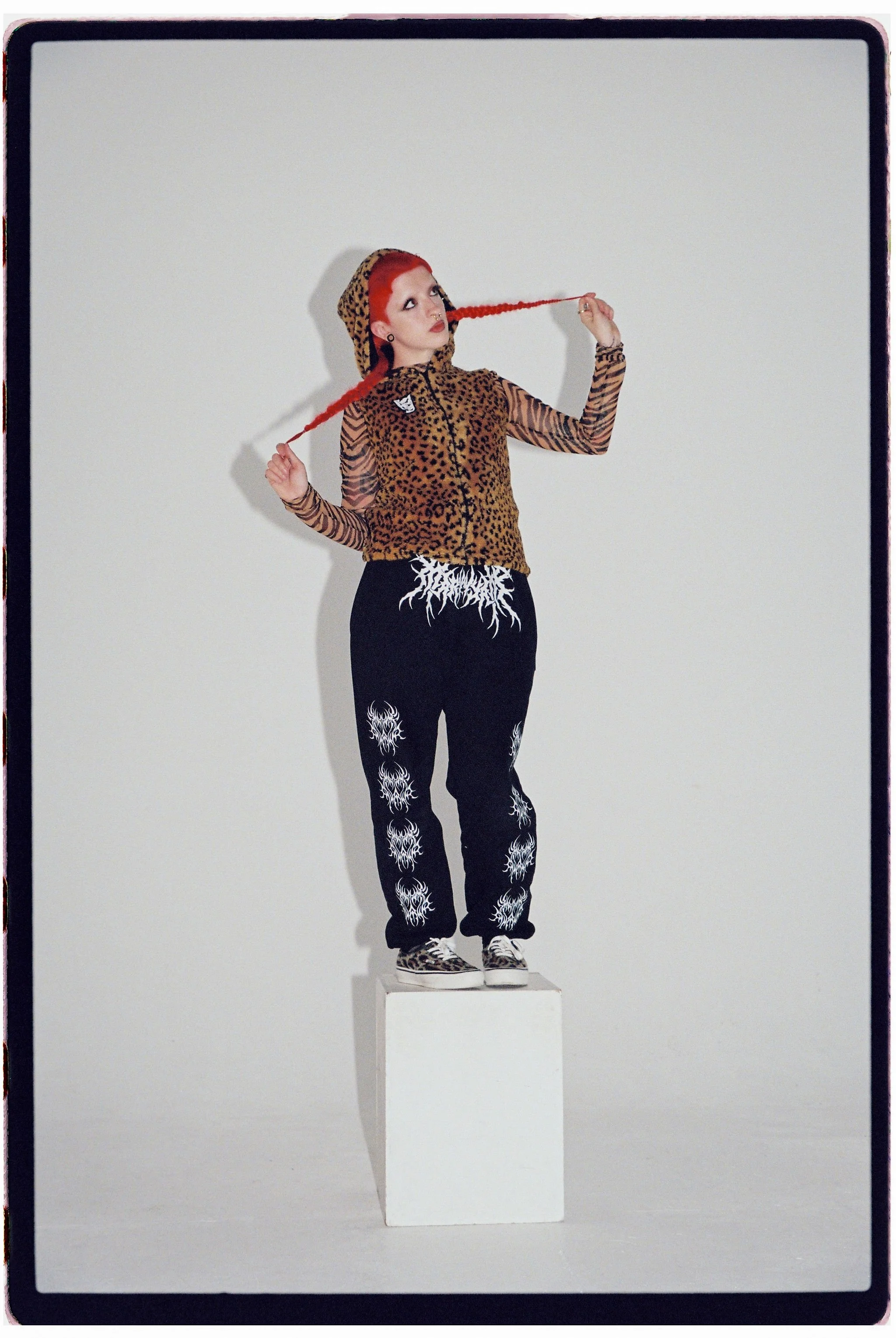   Image above and below, Cody Frost wears -   Leopard print hooded gilet: Empty Brains&nbsp;@emptybrains_ | Tiger print mesh: Urban Outfitters&nbsp;@urbanoutfitterseu | Tracksuit bottoms: Named Collective&nbsp;@named collective | Shoes: Vans&nbsp;@va