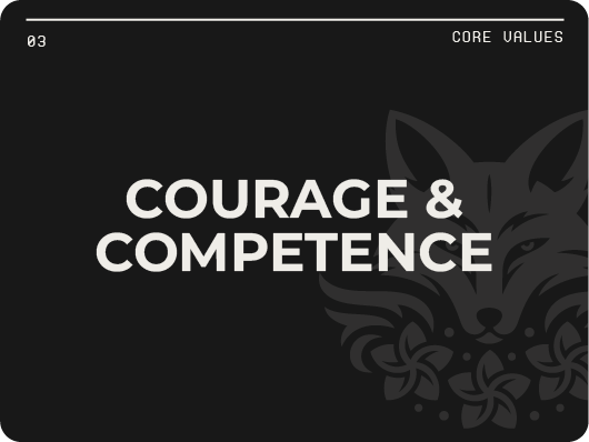 Modern building with a wooden facade and large glass window, set against a mountainous landscape with dry grass and sparse trees.