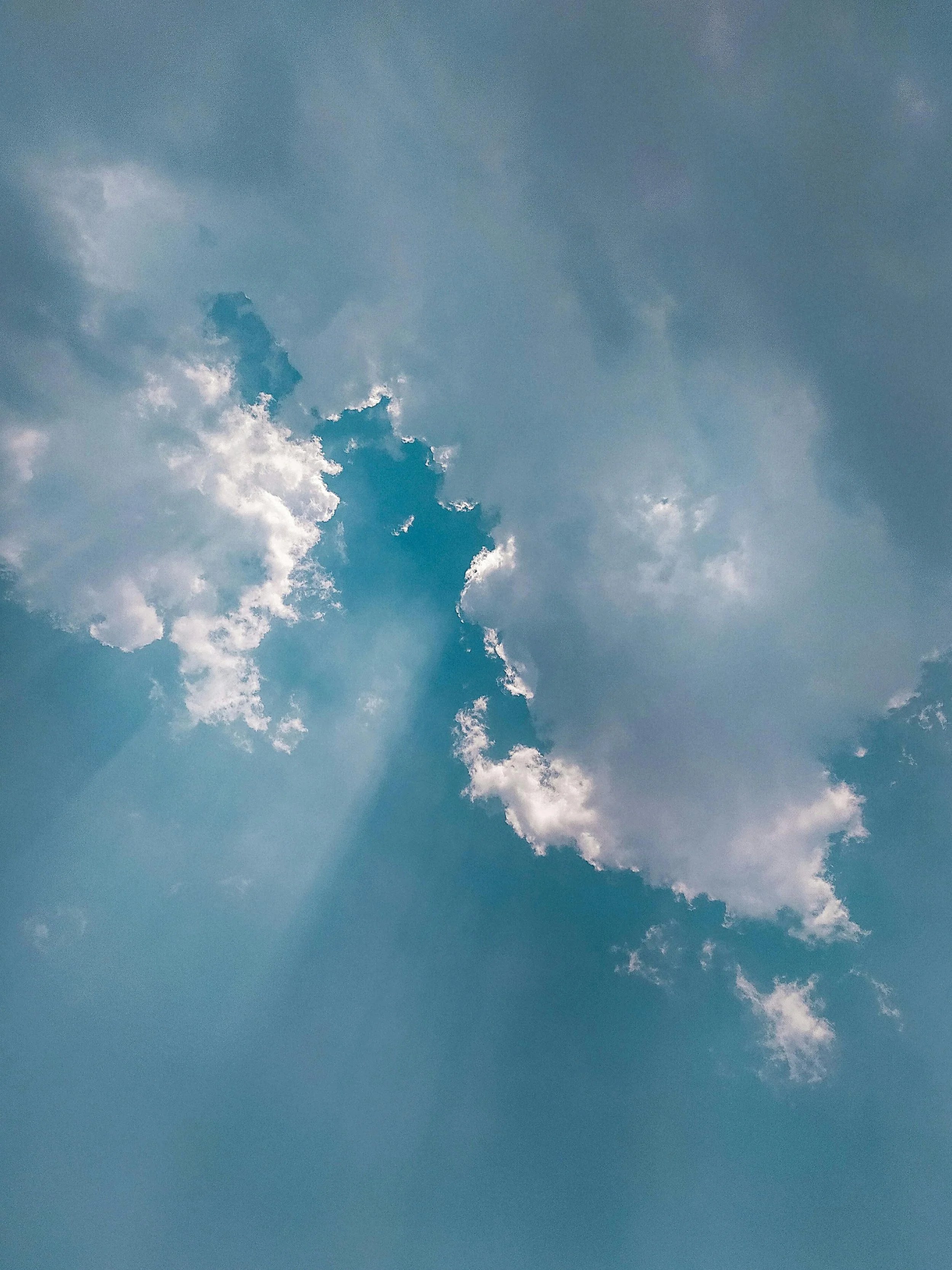 Sky with scattered clouds and patches of blue sky