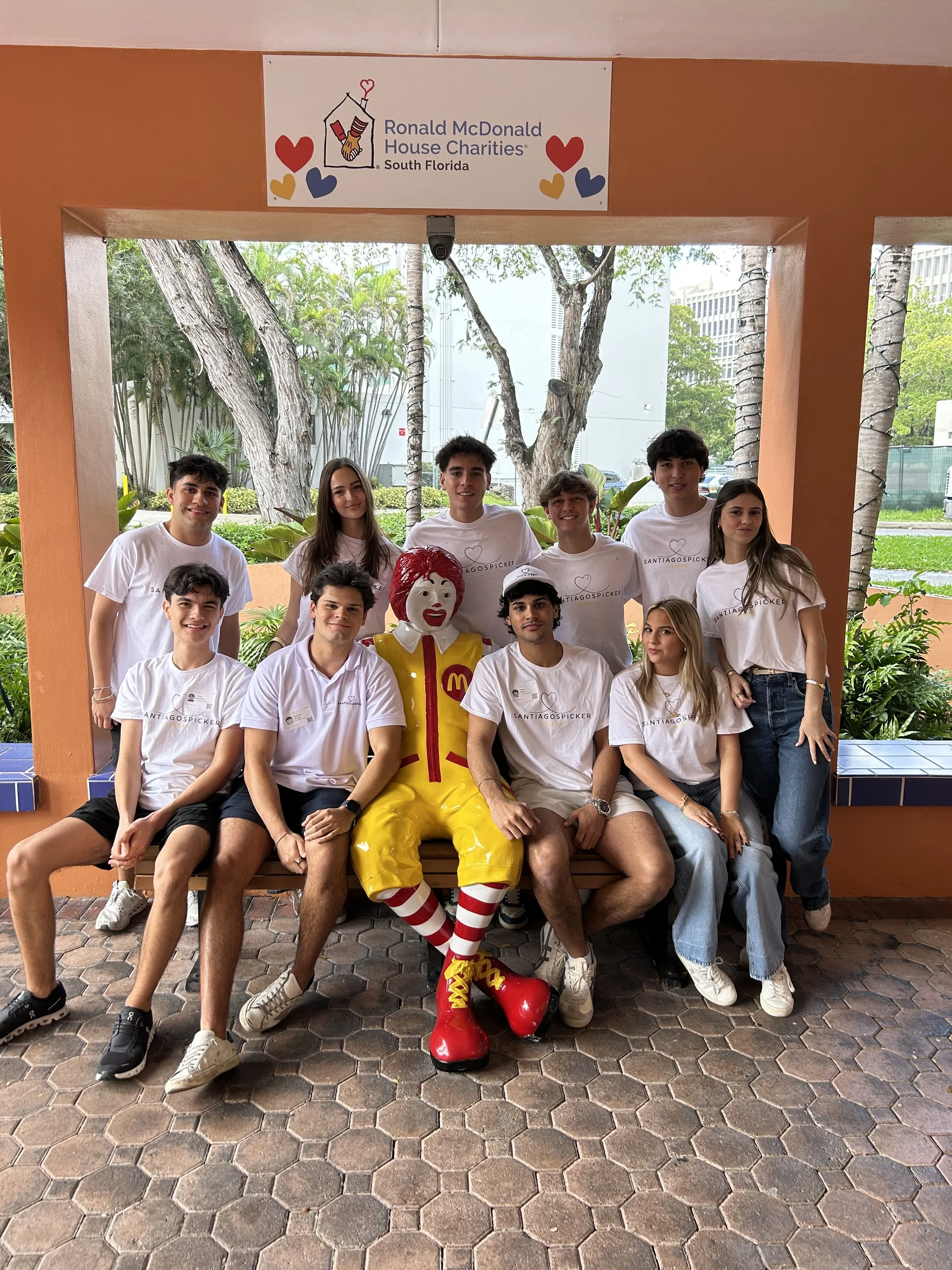 Group of young people posing with Ronald McDonald mascot at Ronald McDonald House Charities event, South Florida.