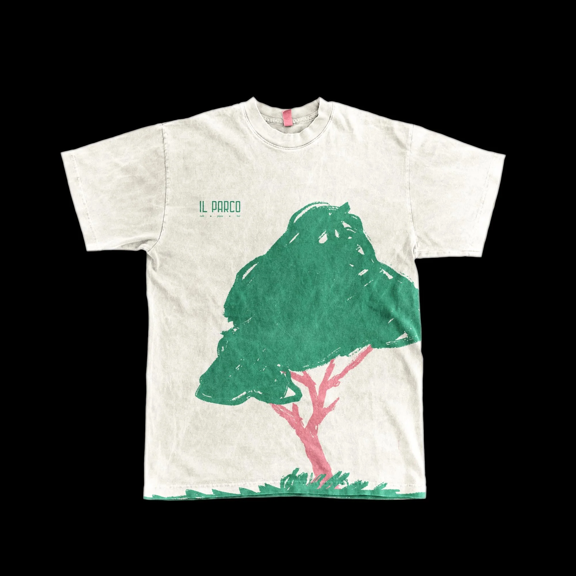 White T-shirt featuring an artistic green and pink graphic of a tree with a large canopy and pink trunk, with 'IL PARCO' text above.