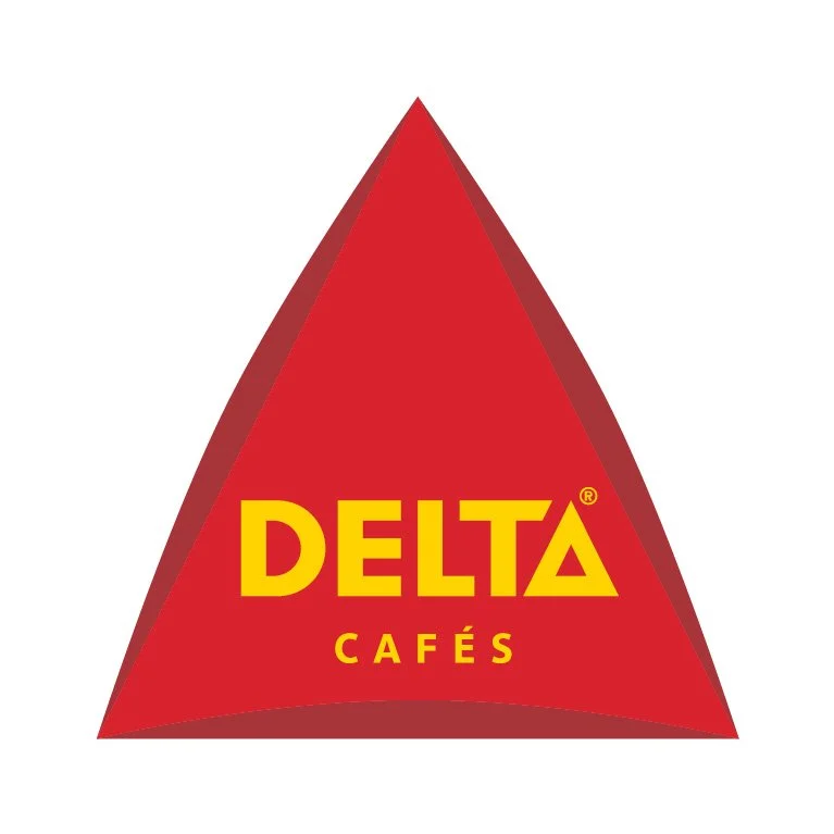 Red triangular logo with the text 'DELTA CAFÉS' in yellow, with 'DELTA' in large uppercase letters and 'CAFÉS' below in smaller uppercase letters.