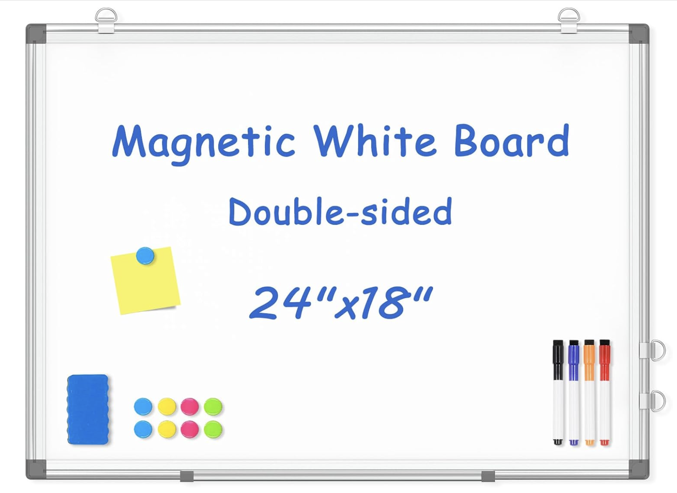 A white magnetic dry erase board with a silver frame, four colored markers in the bottom right corner, and magnetic accessories including a blue eraser, a yellow sticky note, and small colorful circular magnets arranged in two rows. The board has blue handwritten text indicating it is double-sided and measures 24 inches by 18 inches.