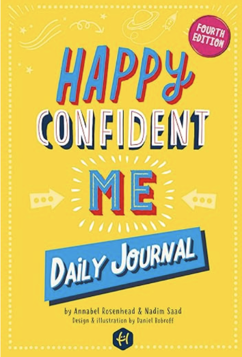 Cover of the book titled 'Happy Confident Me Daily Journal' with a yellow background, colorful text, and a pink circle indicating it's the fourth edition.