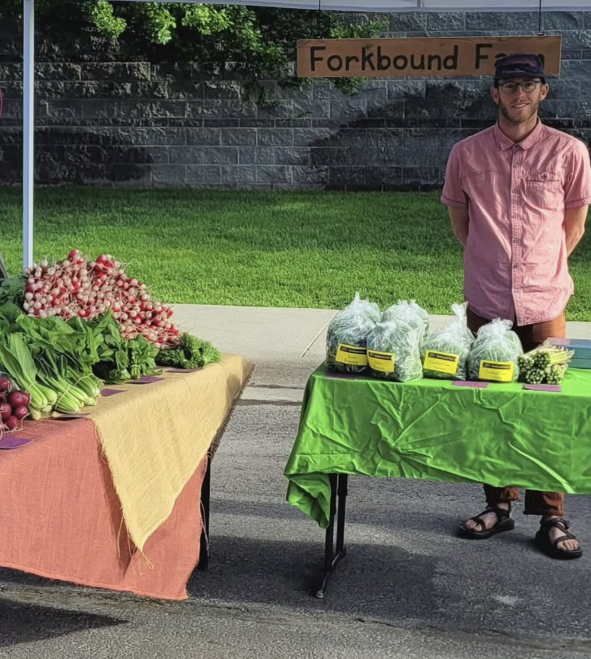 Adam Freierman selling produce at the Kalispell Farmers Market