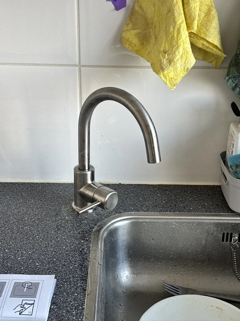 An installed kitchen faucet