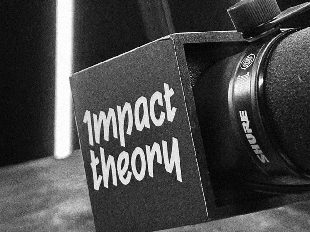 Impact Theory mic on set of the podcast