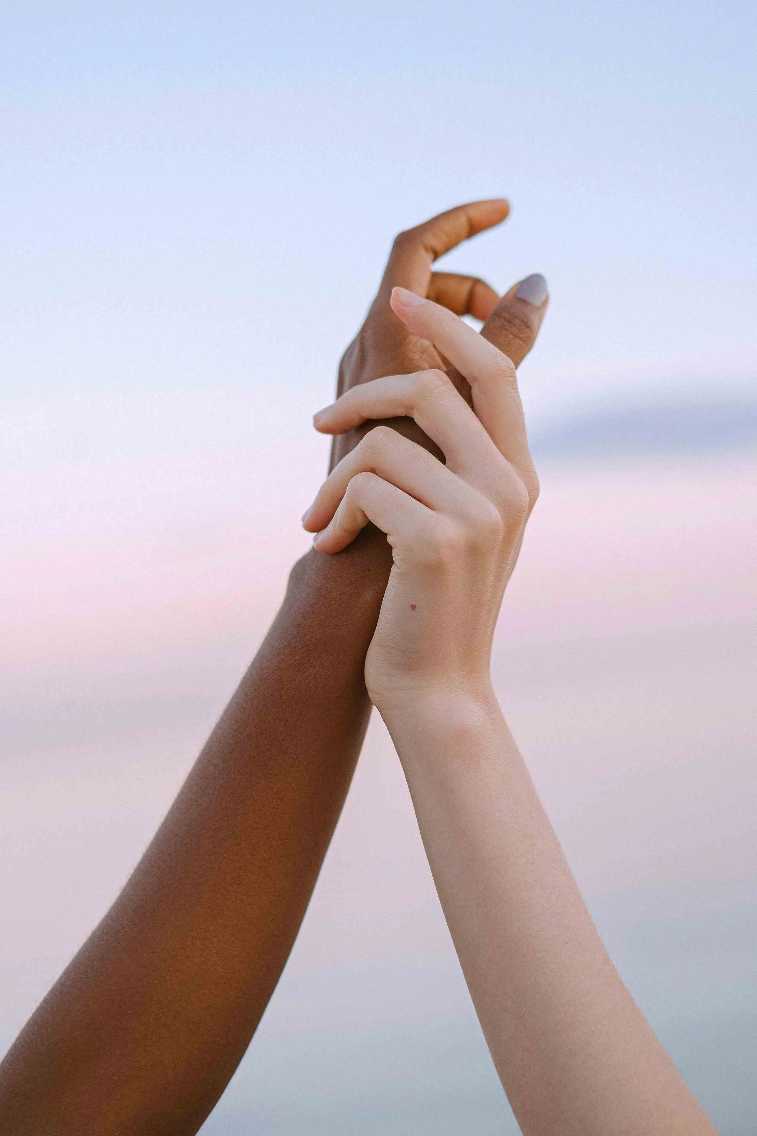 Image of two hands holding each other