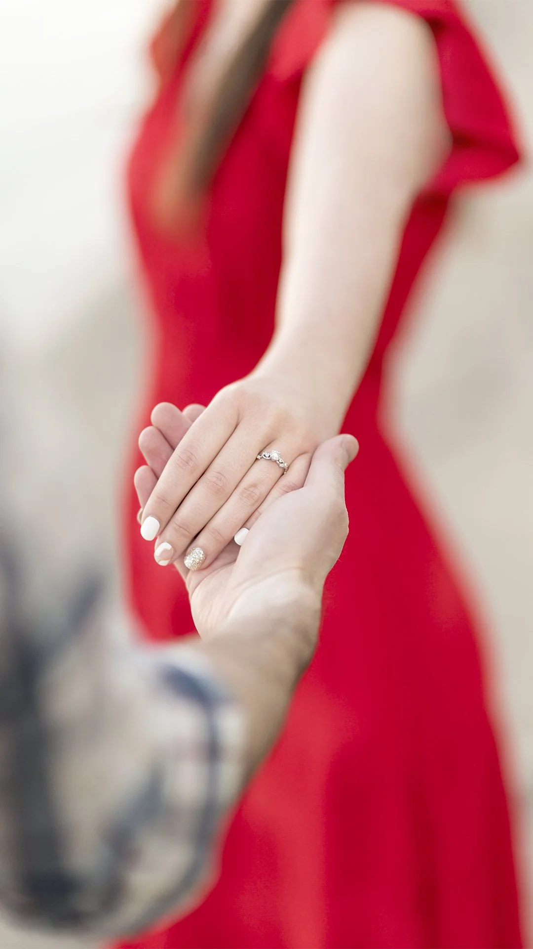 Engagement Session holding hands ring shot