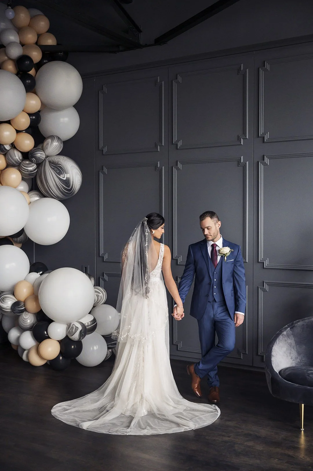 bride and groom with balloons 