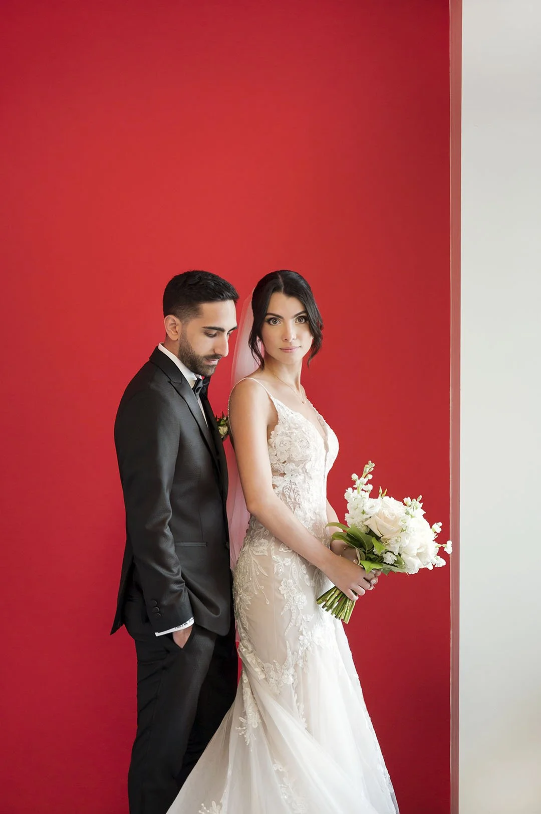 Bride and groom red background