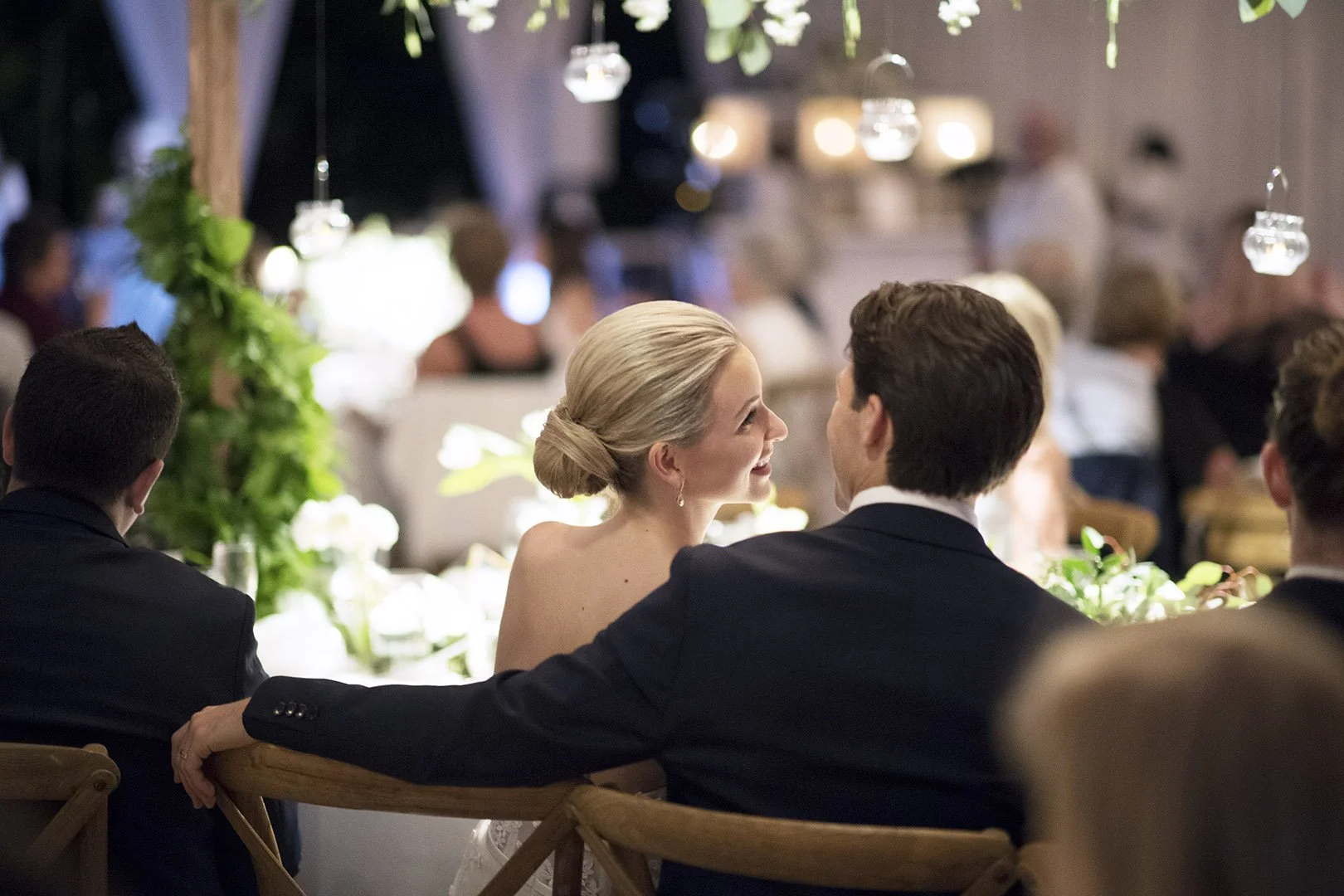 Bride and Groom from the back at the reception