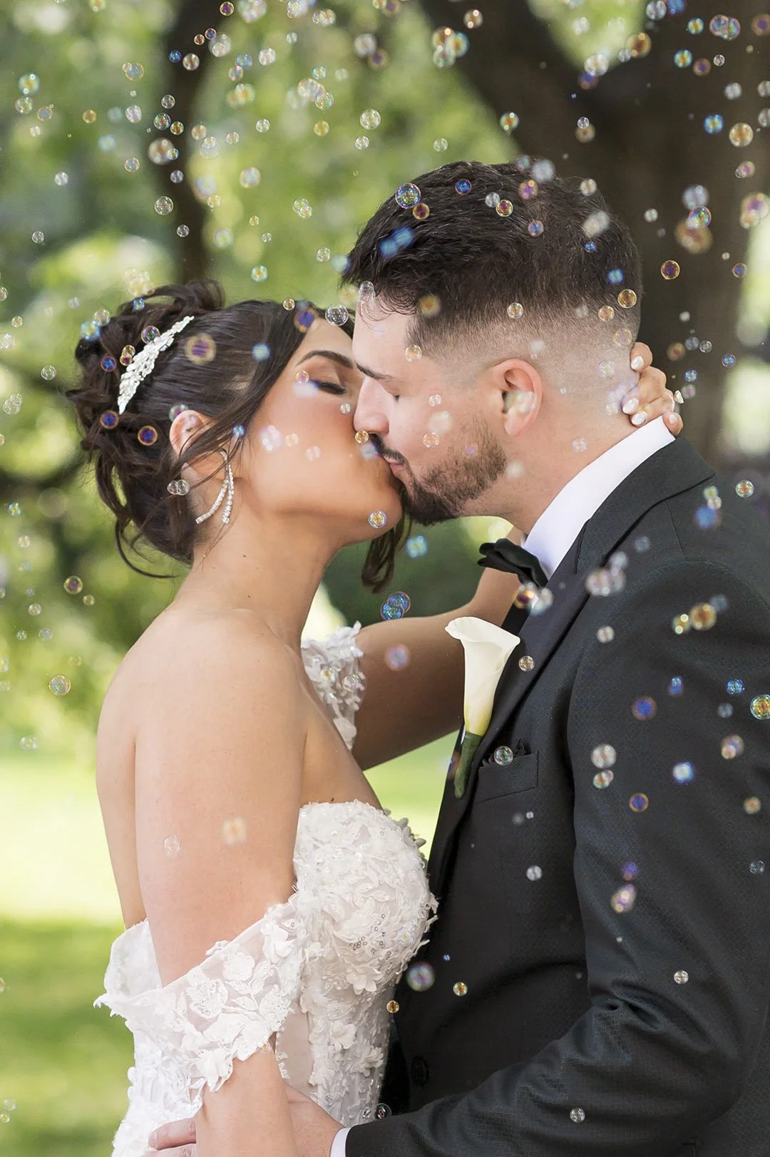 Bride and Groom with Floating Bubbles photo