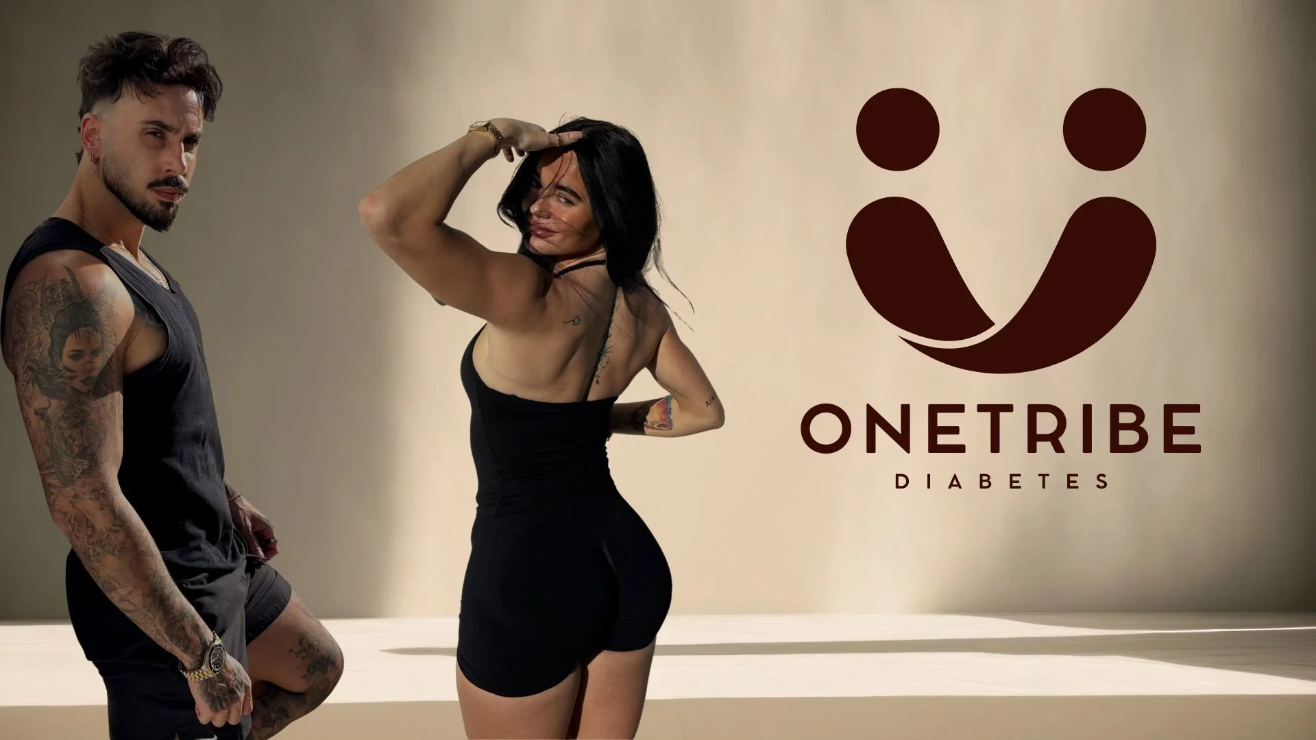 Talia and Joao standing beside ONETRIBE Diabetes logo representing Type 1 diabetes coaching, community and lifestyle support