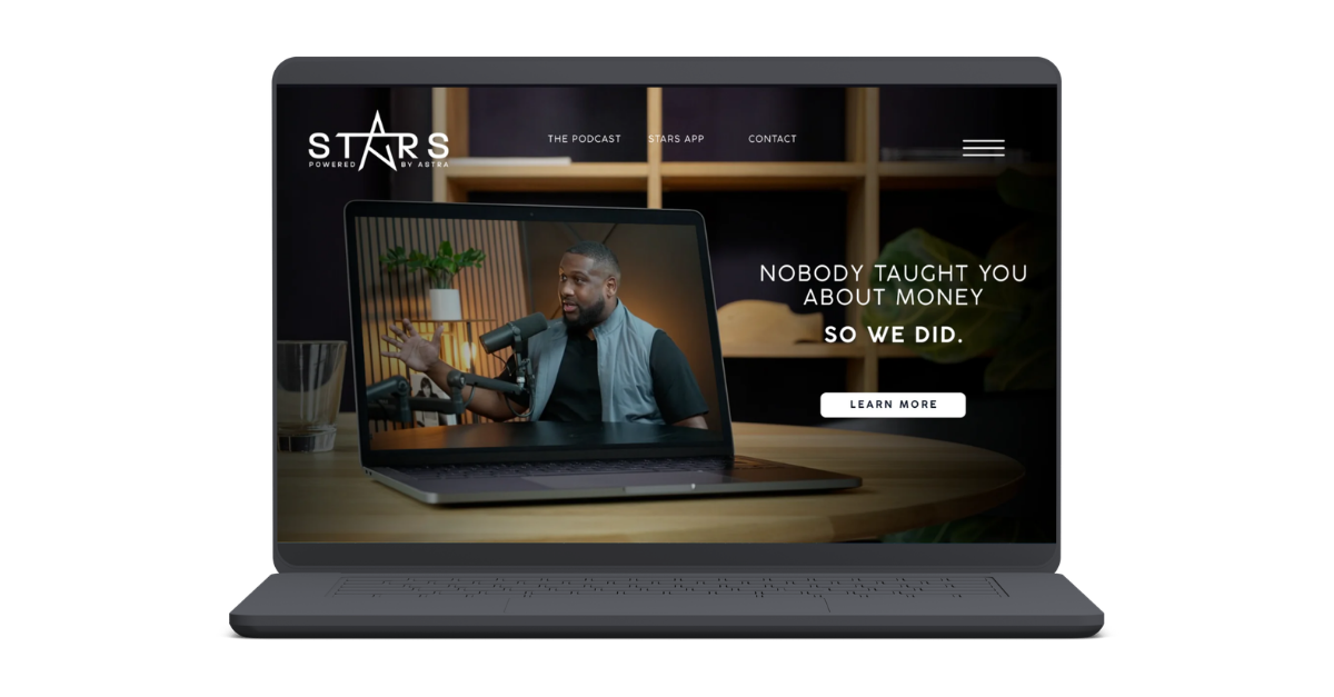 Laptop screen displaying a podcast with a man speaking into a microphone, and text that reads 'Nobody taught you about money so we did.'