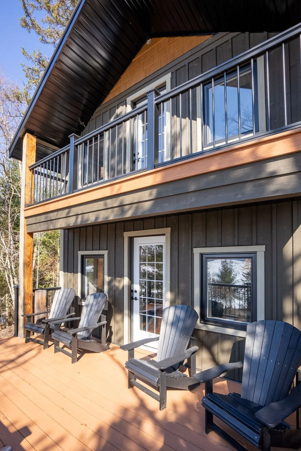 A sun-drenched waterfront retreat overlooking the Rideau Lakes, designed to capture natural light and uninterrupted views in a peaceful cottage setting. Built by Centennial Construction Management