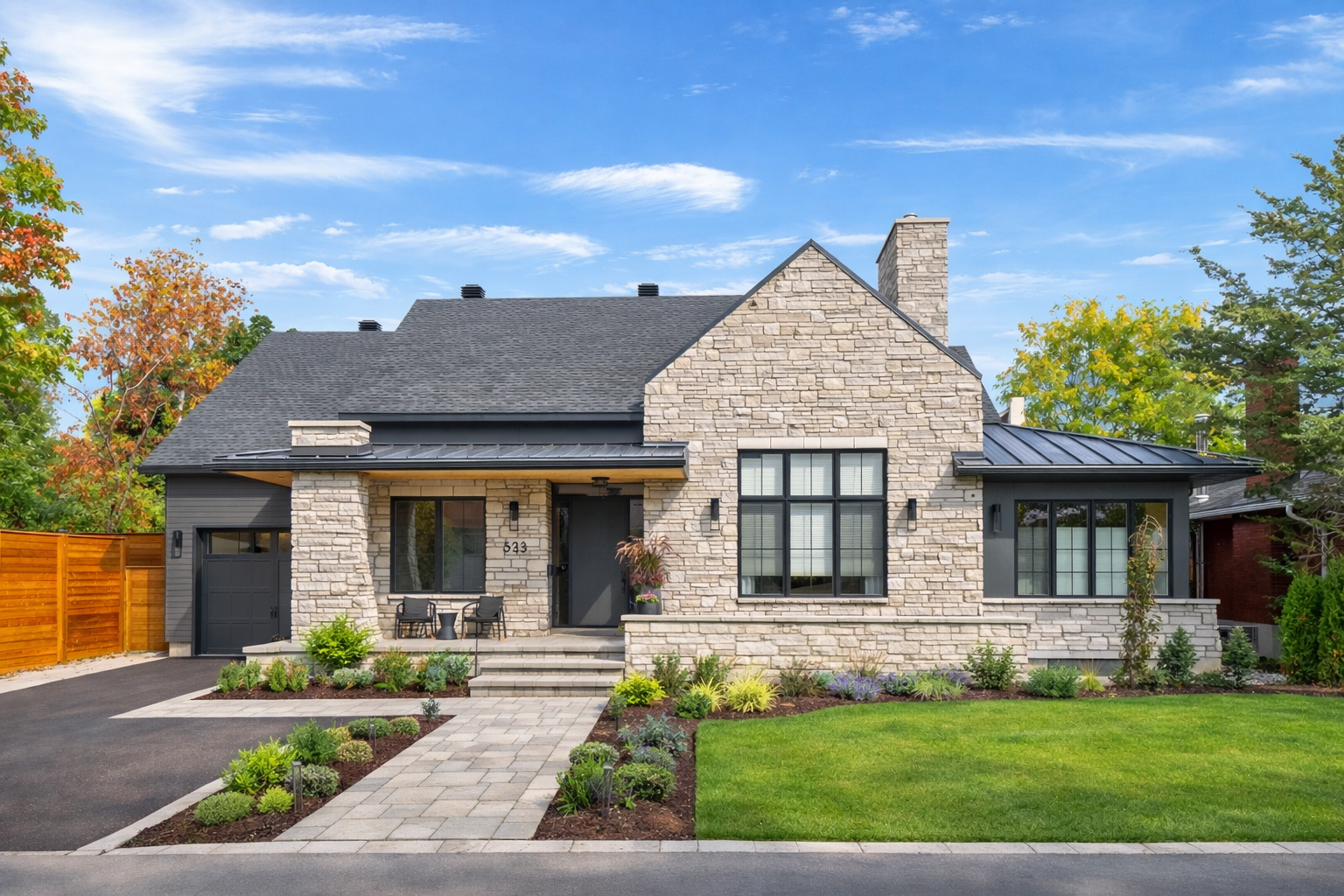 Luxury custom home in Mckellar Park Ottawa with natural stone exterior, modern landscaping, and high-end craftsmanship by Centennial Construction Management