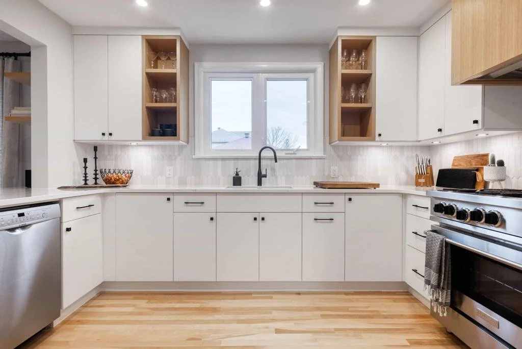 Ottawa kitchen renovation in Glabar Park transforming an original 1940s home with sleek modern design, custom cabinetry, and high-end finishes by Centennial Construction Management.