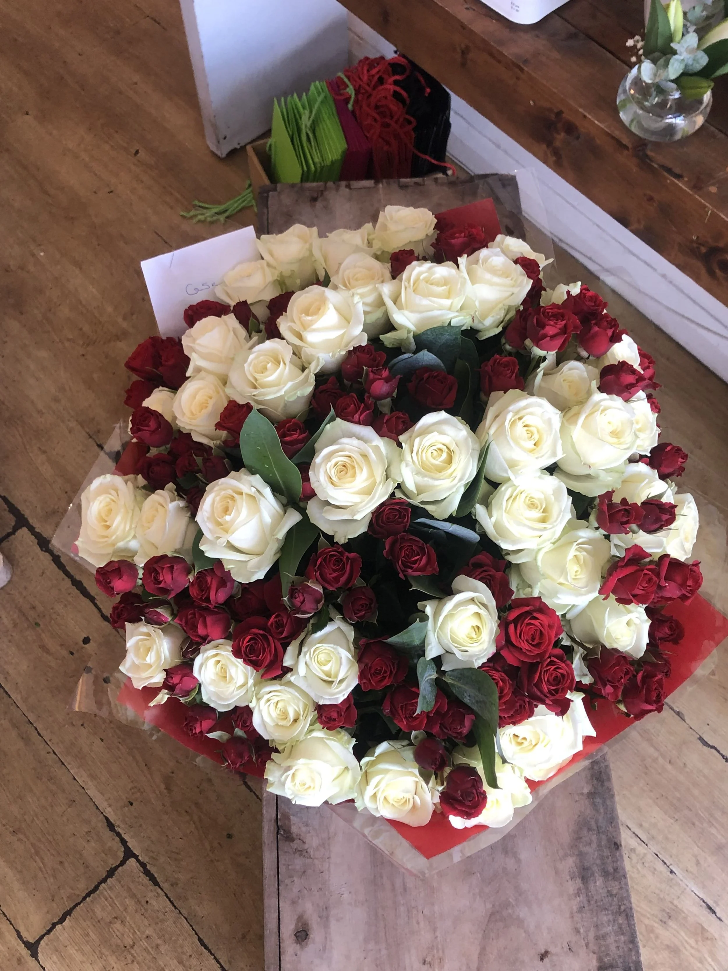 100 roses white sprayed red.jpg
