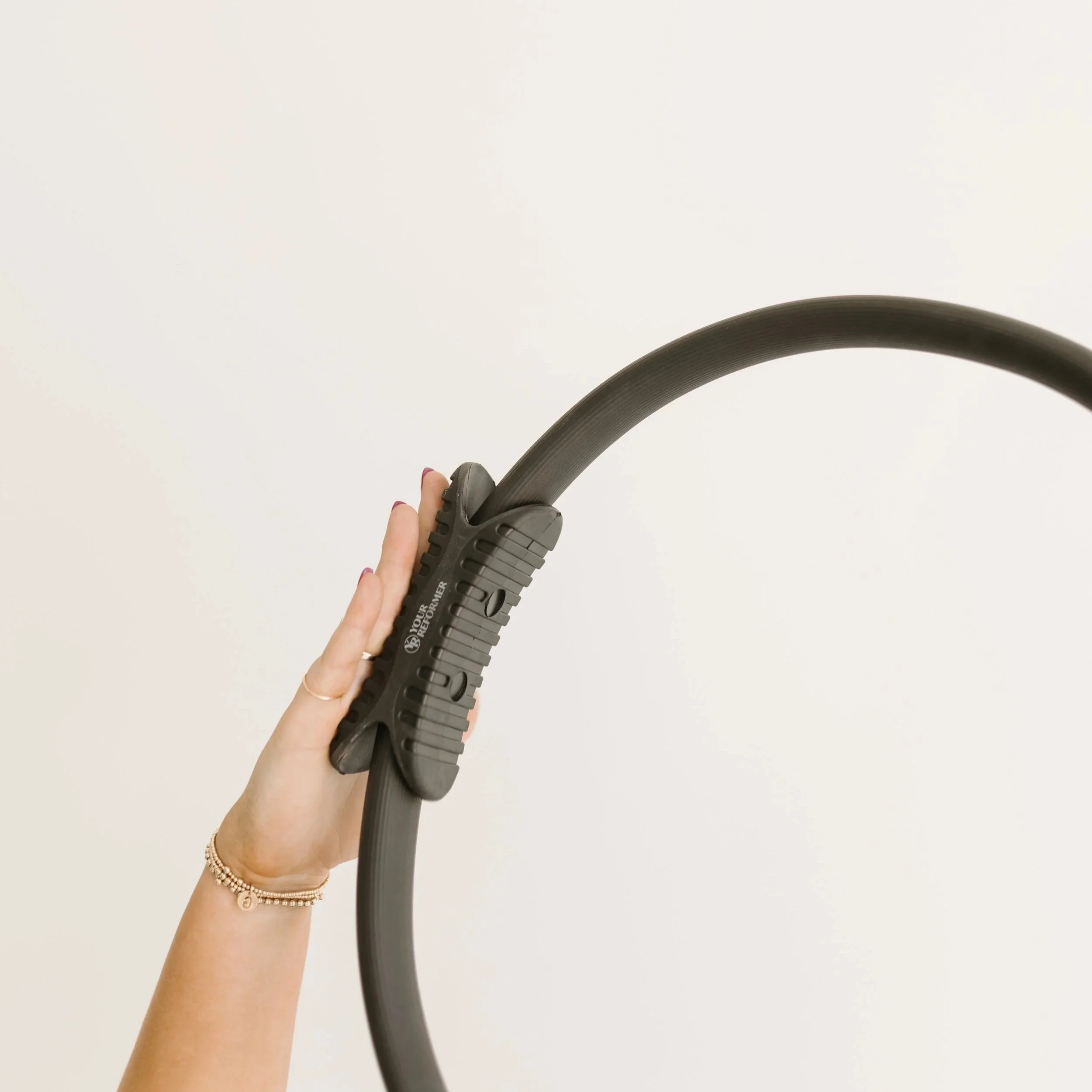 Photograph of a pilates ring, a piece of workout equipment used during the group reformer pilates classes at Worth It: A Reformer Pilates Studio located in Keller Texas, near Dallas, Texas and Fort Worth, Texas.
