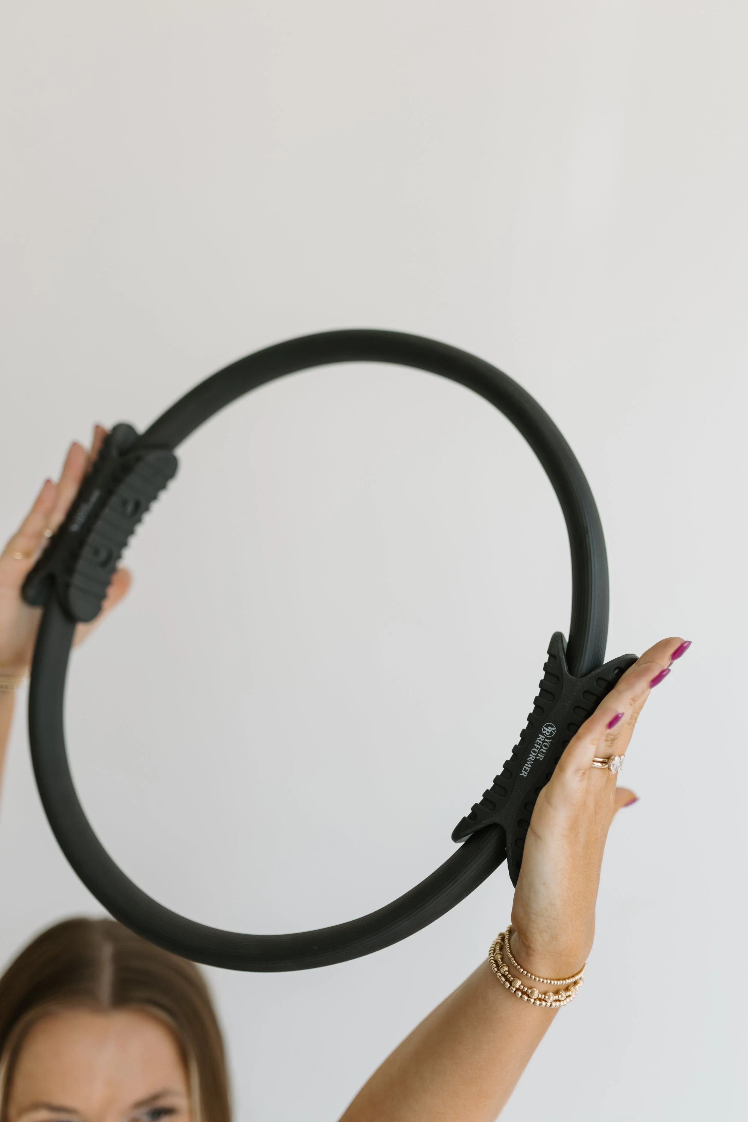 Photograph of a pilates ring, a piece of workout equipment used during the group reformer pilates classes at Worth It: A Reformer Pilates Studio located in Keller Texas, near Dallas, Texas and Fort Worth, Texas.
