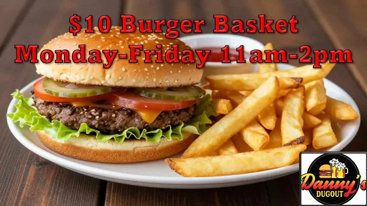 A plate with a cheeseburger containing lettuce, tomato, pickles, cheese, a beef patty, and a sesame seed bun, served with French fries and a small cup of dipping sauce, with promotional text for a burger basket special.