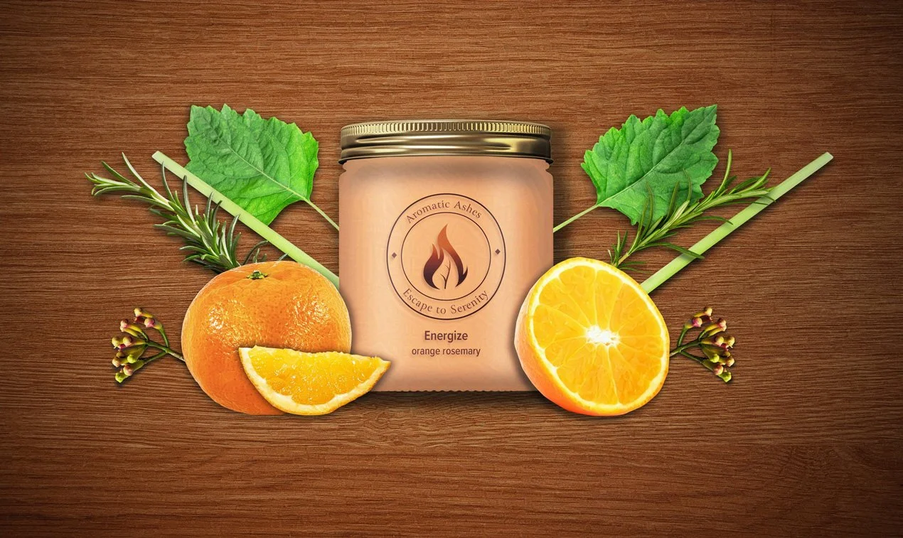 Scented candle labeled "Energize orange rosemary" surrounded by orange slices, lemongrass, patchouli leaves, cloves, and rosemary sprigs on wooden background.