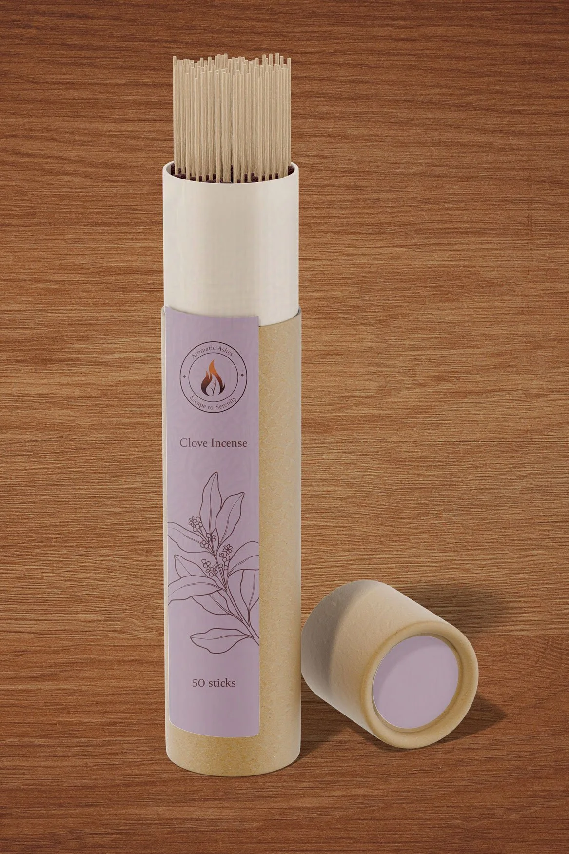 Container of clove incense sticks with a beige cylindrical box and a purple label, standing on a wooden surface.